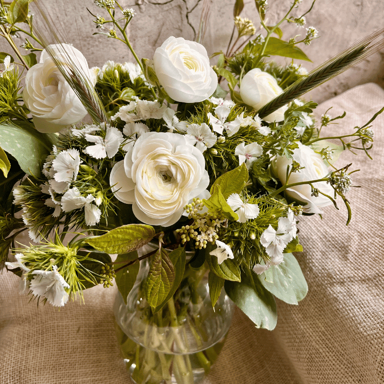 flowers in golden yellow and orange shown with beige backround